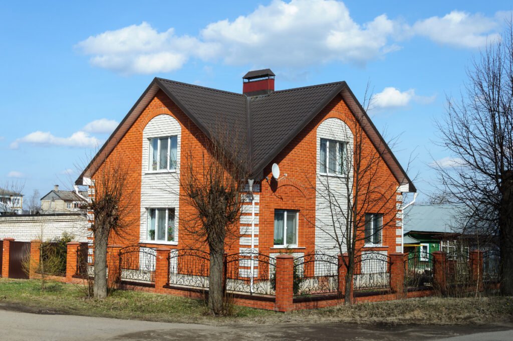Orange Brick House with Gray Roofs