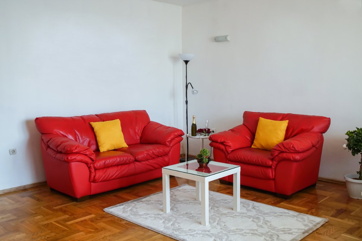 Red-Couch-and-Yellow-pillows-in-Living-Space