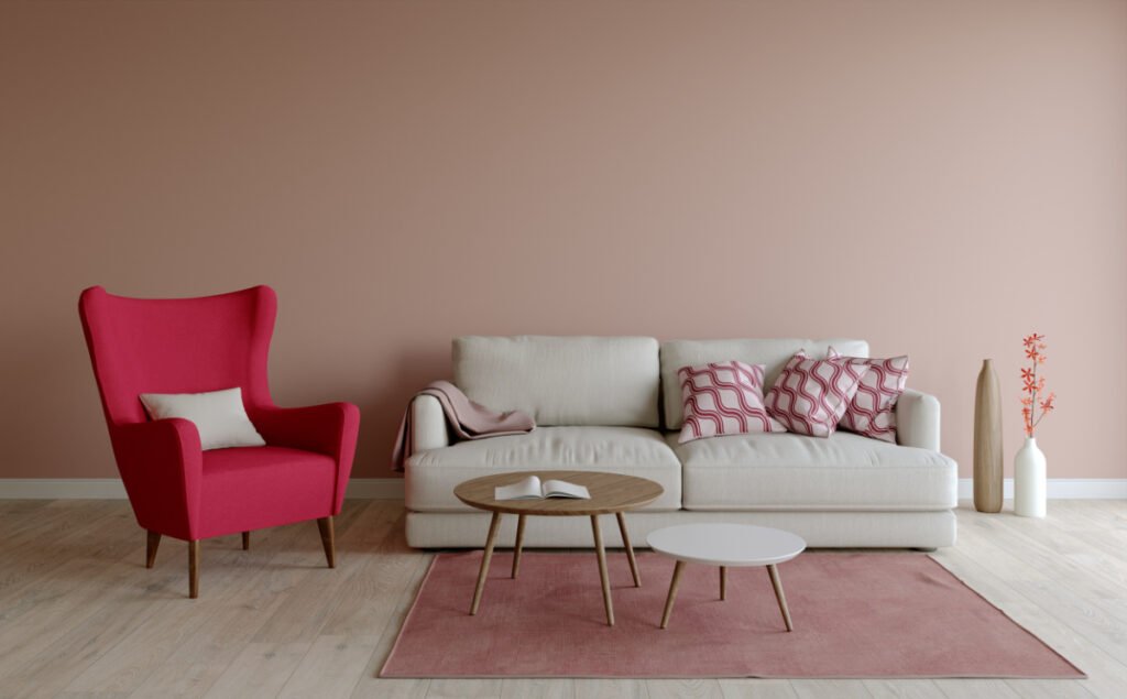 A Hot Pink Chair Near A Light Gray Sofa
