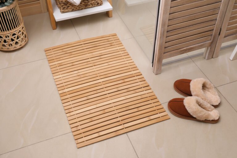 A Lovely Bamboo Bath Mat Outside a Bathroom
