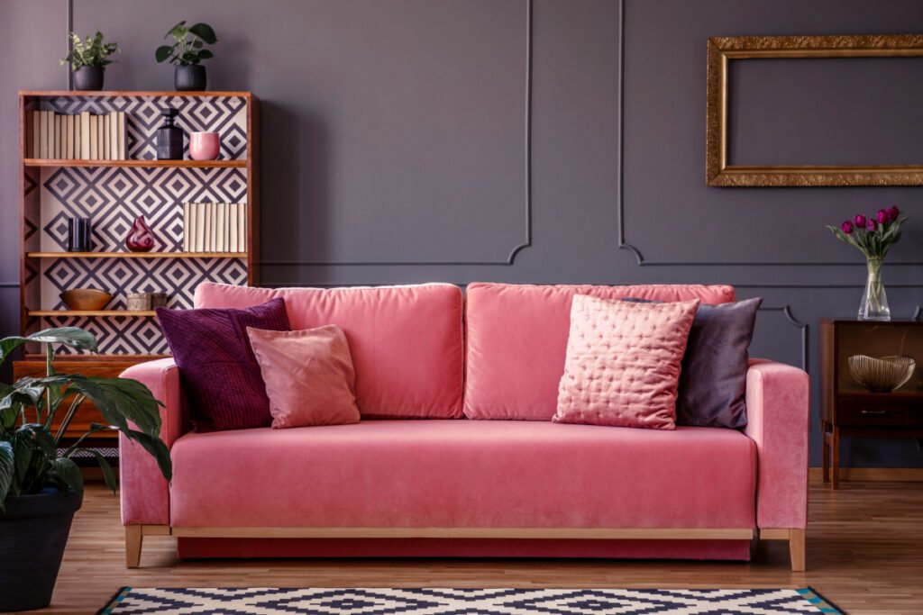 Pink Couch on Dark Wood Floors
